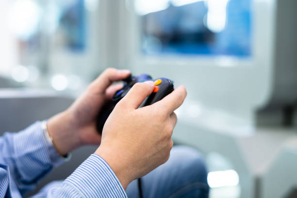 Asian young handsome man is playing video game