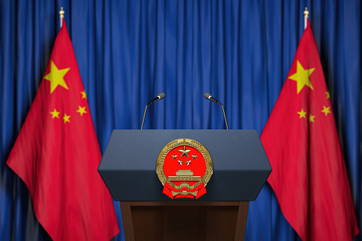 Official press conference of China fgoverment or president. Tribune, flags of China and microphones. 3d illustration