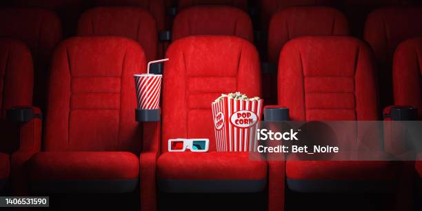 Red Cinema Seats And Cola Popcorn And Glasses In Empty Theater Cinema Movie Theater Concept Background Stock Photo - Download Image Now