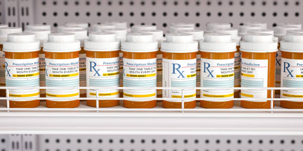 row of drug bottles and pill tablet box on the farmacy shelf. - farmaceutische fabriek stockfoto's en -beelden