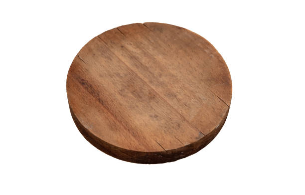 istock Circular wooden cutting board isolated cutout on white background. Overhead view, copy space. 1406531933