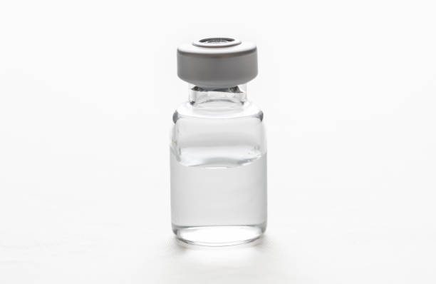 istock Medical vial for injection isolated cutout on white background. Overhead view, copy space. 1406532025