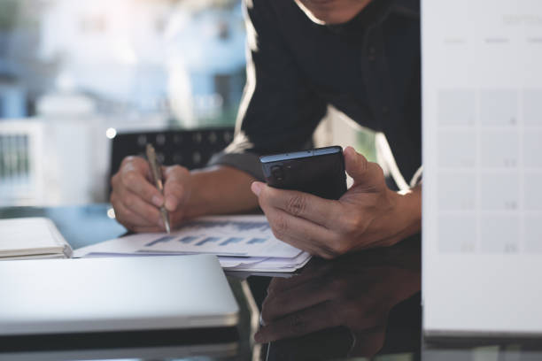 istock Business man analyzing marketing report, working in modern office 1406534440