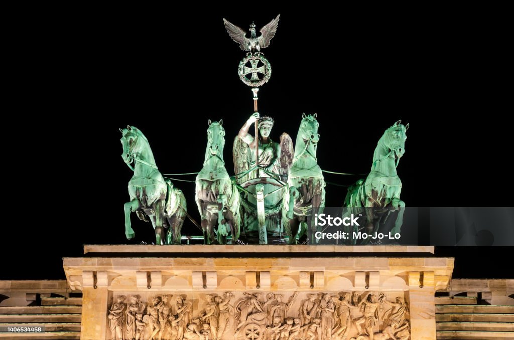 Quadriga statue  on the top of Brandenburg Gate, Berlin, Germany Quadriga statue  on the top of Brandenburg Gate, german capital of Berlin, Germany by night Prussia Stock Photo