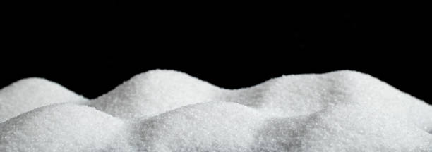 istock Fluffy white snow hills on black background. 1406536158