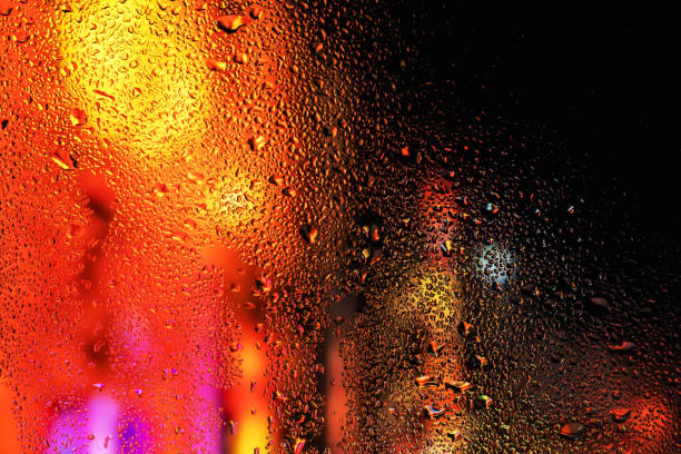 istock Condensation on the clear glass window. Water drops. Rain. Abstract background texture 1406536530