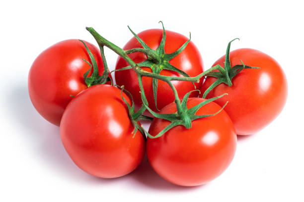 istock A brush of large tomatoes on a white background. Studio photo, isolate, tomatoes, washed 1406536886