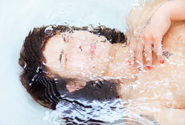 istock Woman taking hot shower 1406540780