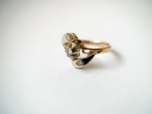 istock Gold diamond ring on a white isolated background. Red Gold Ring 1406544417