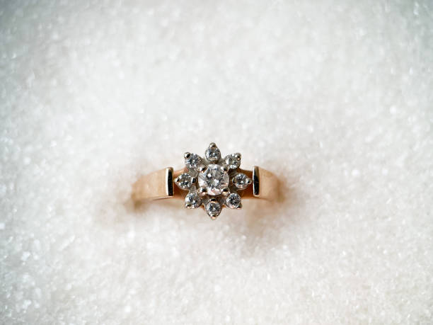 istock Gold diamond ring on a white isolated background. Red Gold Ring 1406544423
