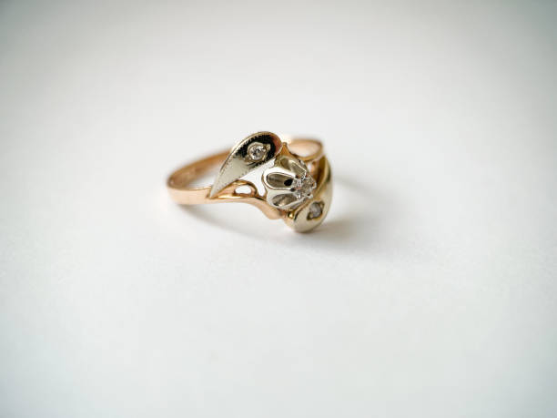 istock Gold diamond ring on a white isolated background. Red Gold Ring 1406544428