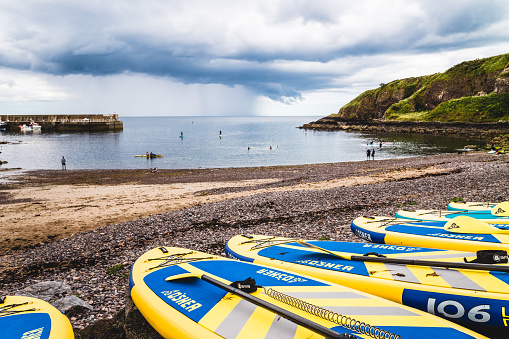 Paddleboarders at the town of Stonehaven on the Aberdeenshire region of Scotland.
