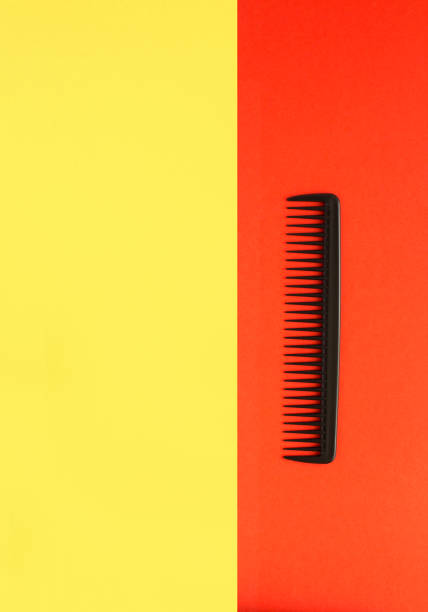 istock Black comb on the colored background. Top view. Copy space. 1406546824