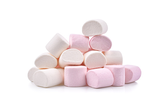 Heap of pink and white candy marshmallows isolated on white background