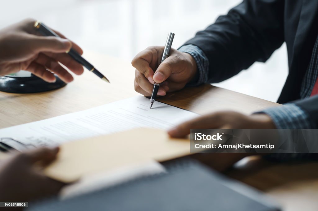 The Legal Execution Department makes an appointment with the customer to sign a mediation agreement to pay the debt. Legal System Stock Photo