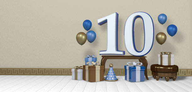 istock White number 10 with blue border on wooden table surrounded by bright gift boxes and balloons floating on wooden floor in empty room with pastel yellow wall. 3D Illustration 1406548535