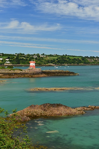 Summer coastal landscape and tower.