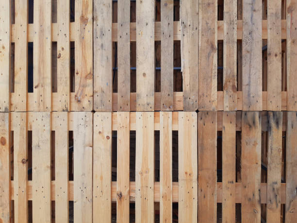 istock Pallet wall background. Eco-friendly full frame pallets. Wood Pallets plank texture background. Wall with overlapping pallets. Recycle crafts. 1406553041