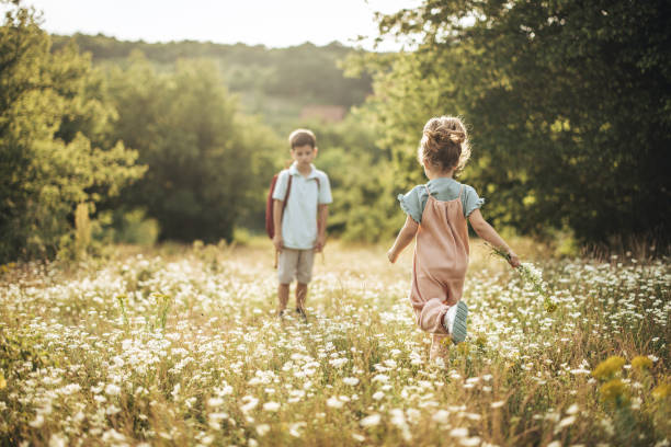 istock Little brother and sister in nature 1406553071