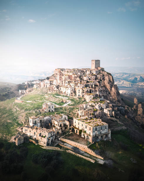 Abandoned Ghost Town Craco in Italy This is a photo of the abandoned town called Craco, in southern Italy. Craco is one of the most famous abandoned towns in the country, and perhaps in the world. It is the little brother of the up-and-coming city of Matera. matera stock pictures, royalty-free photos & images