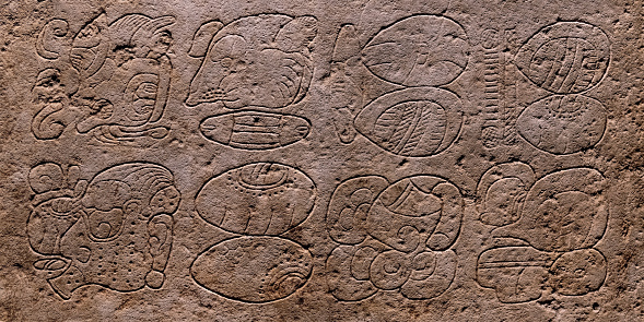 Panoramic stone stela or stele with maya hieroglyphics in Palenque, Mexico.