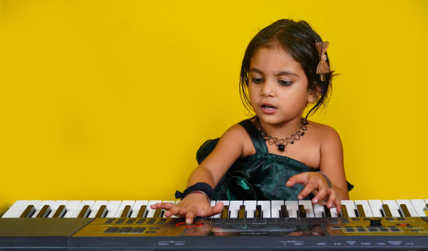 Adorable Cute Girl Playing Piano Concept