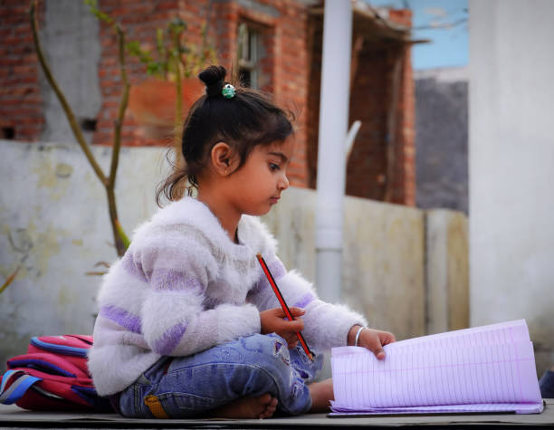 istock cute girl learn books image 1406561067
