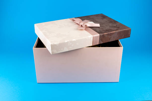 istock Black friday gift box with pink bow on blue background. Horizontal, banner, postcard. 1406562257