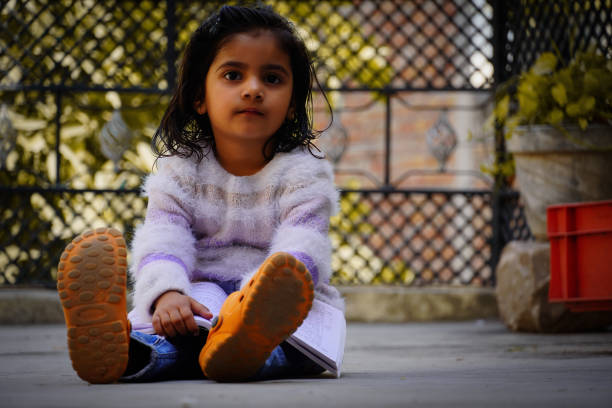 indian Cute little girl read the book