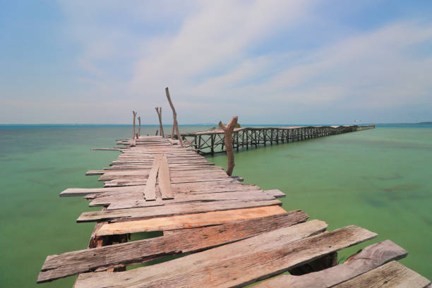 istock Long Woods bridge on the sea 1406562594