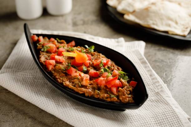 istock Ful Medames with bread served in a dish isolated on grey background side view fast food 1406564009