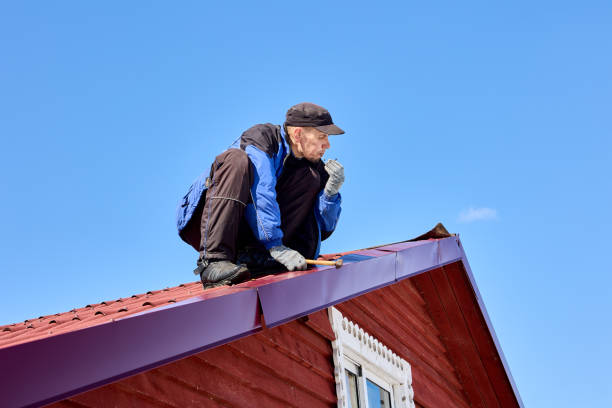 istock Nailing into tin roof while roofing, worker uses  hammer to fix roof. 1406568238