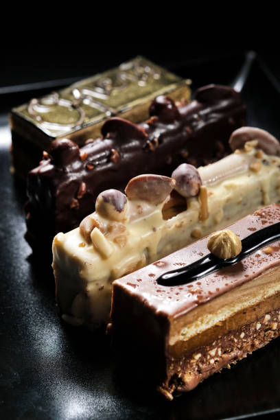 istock Close up vertical view four diverse chocolate desserts in plate 1406568920