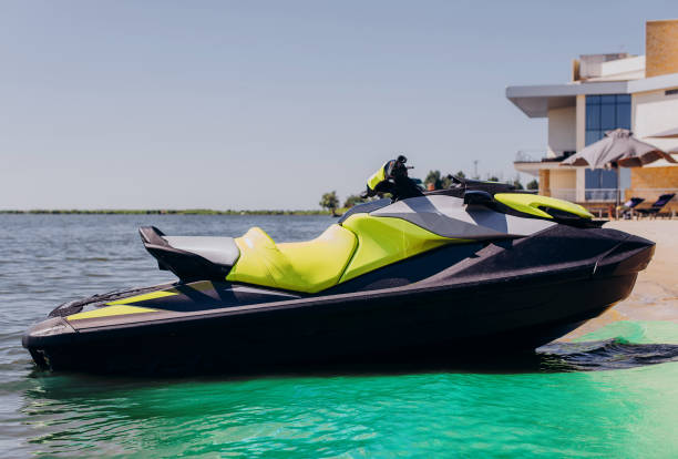 istock Yellow white water scooter is in the blue sea 1406568981