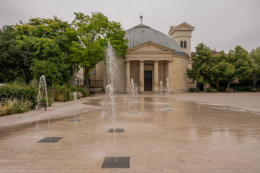 Reflections on the wet floor of the Church of Saint-Pierre-Saint-Paul in Courbevoie