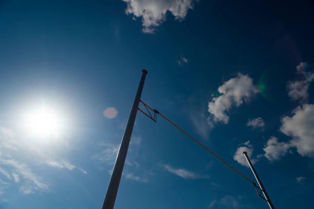 istock Pole vault against blue sky with sun. Horizontal sport theme poster, greeting cards, headers, website and app 1406572354