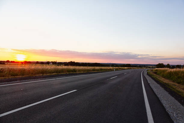 istock Country road in rural Germany at sunset 1406573880