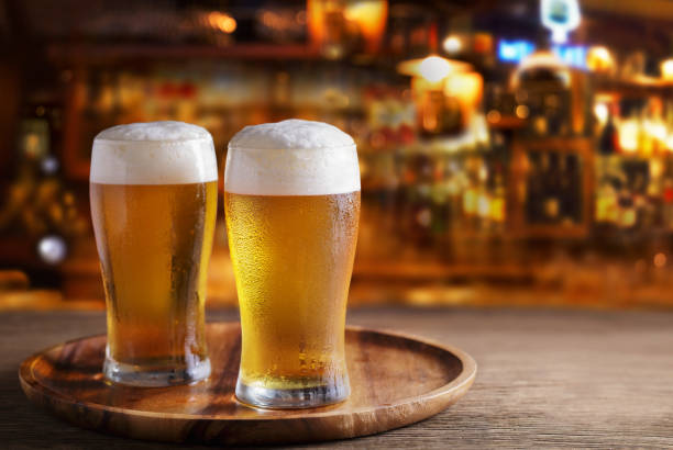 istock Glasses of beer in a bar 1406575288
