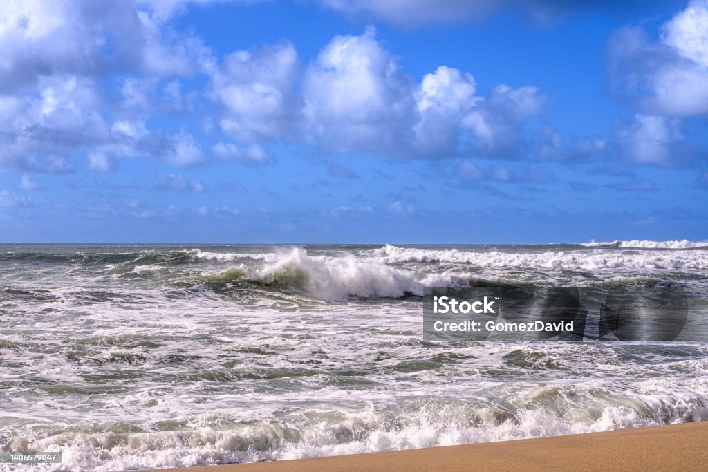 Turbulent Ocean Waves On Beach Off California Coast Turbulent ocean waves crashing on sandy beach, off the California Coast, after a pacific coast storm passed through the area.

Taken at Davenport Landing, California, USA Activity Stock Photo