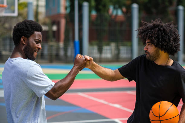 istock two stylish afro young men enjoying basketball 1406580426