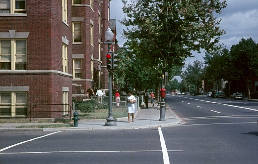 Washington DC, USA, 1962. Street scene on a street corner in Washington DC. Furthermore: pedestrians and residents.