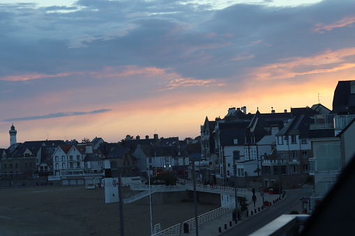 During the heat wave in France on June 19th 2022, people go outside at the evening for fresh air in Quiberon, brittany