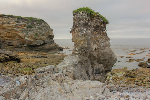 istock eroded land by the sea 1406583043