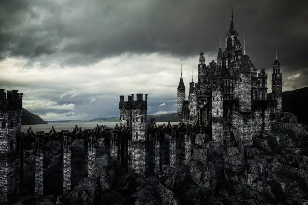 Photo of Dark fantasy medieval castle in rocky landscape by a lake with moody grey clouds. 3D rendering.