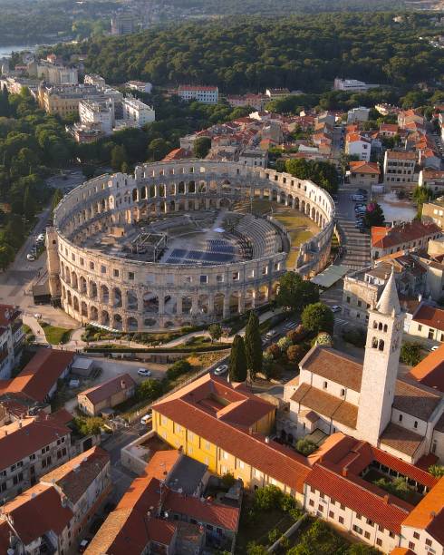 Drone shot of Pula Arena, Croatia Drone shot of Pula Arena, Croatia rovinj harbor stock pictures, royalty-free photos & images