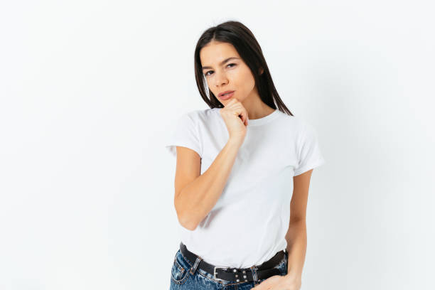 istock Young woman looking at camera with incredulous expression 1406590742