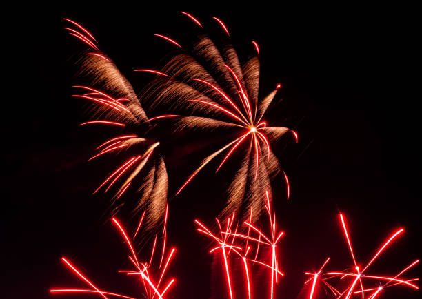 istock Playing with fireworks in the night sky 1406591182