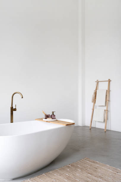 istock Tub with copper faucet and personal accessories 1406592459