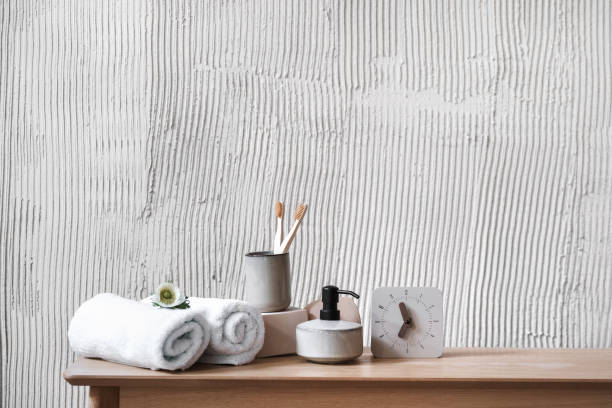 istock Bathroom table with personal accessories against textured wall 1406593341