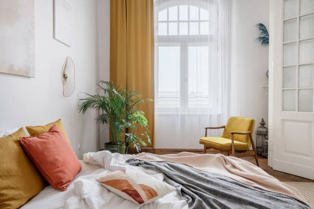 istock Bright bedroom with interior design in the style of the boho chic 1406593410